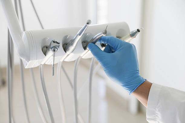 Professional Dental Implants technician working in East Highland Park, VA